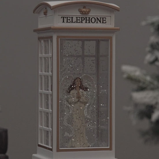 telephone booth christmas snow globe angel video