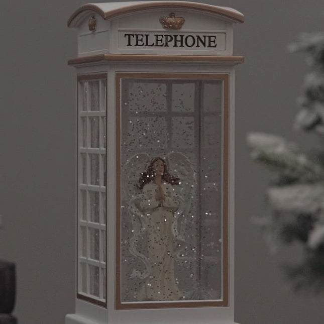 telephone booth christmas snow globe angel video