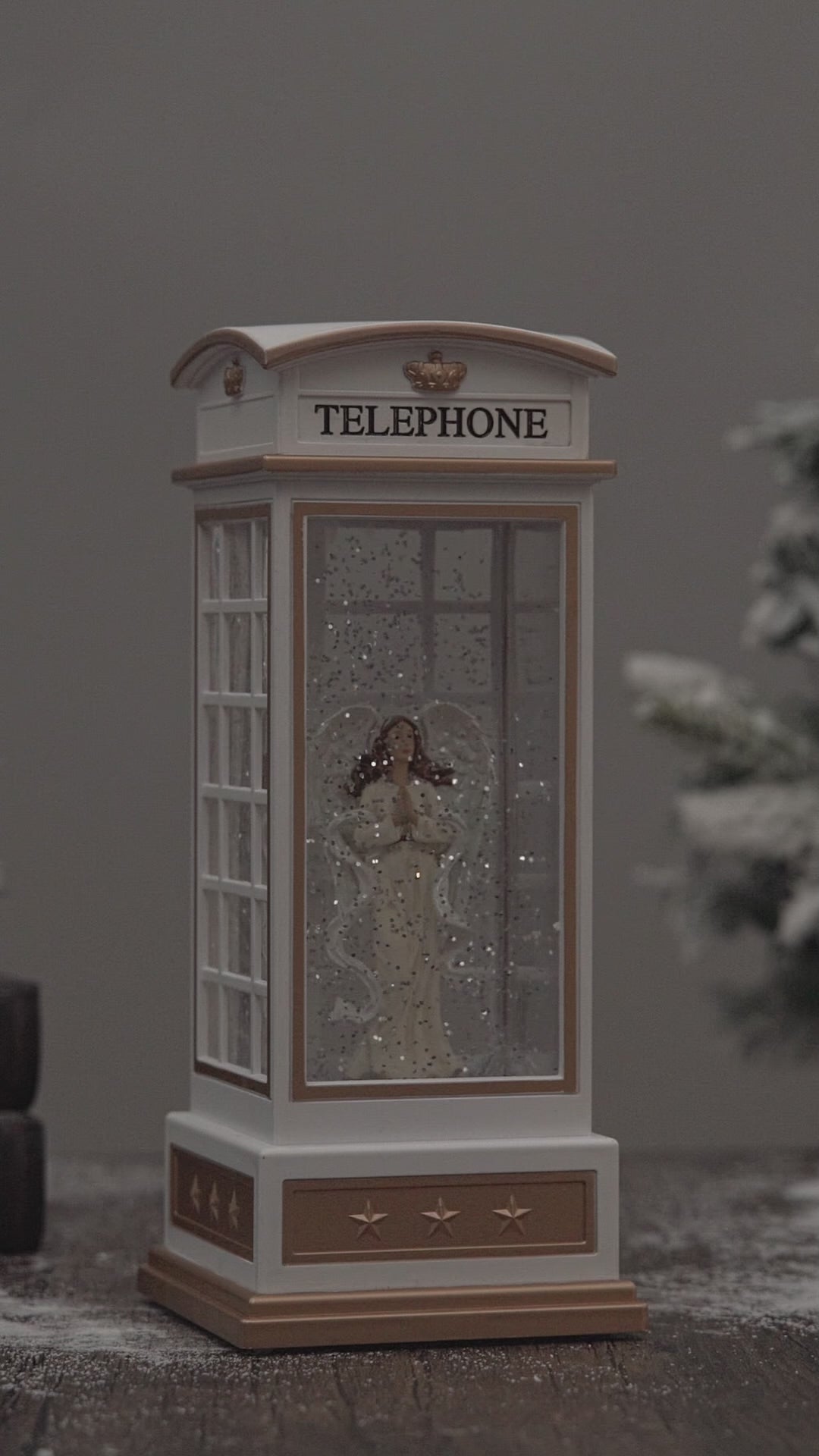telephone booth christmas snow globe angel video