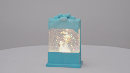 Decorative snow globe present shape with characters inside, featuring 'House worX' branding. video