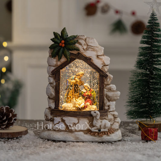Decorative nativity scene in a stone enclosure with lights, surrounded by Christmas decorations. Snow Globe