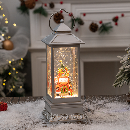 Decorative lantern with Christmas scene inside, placed on a snowy surface with festive background.