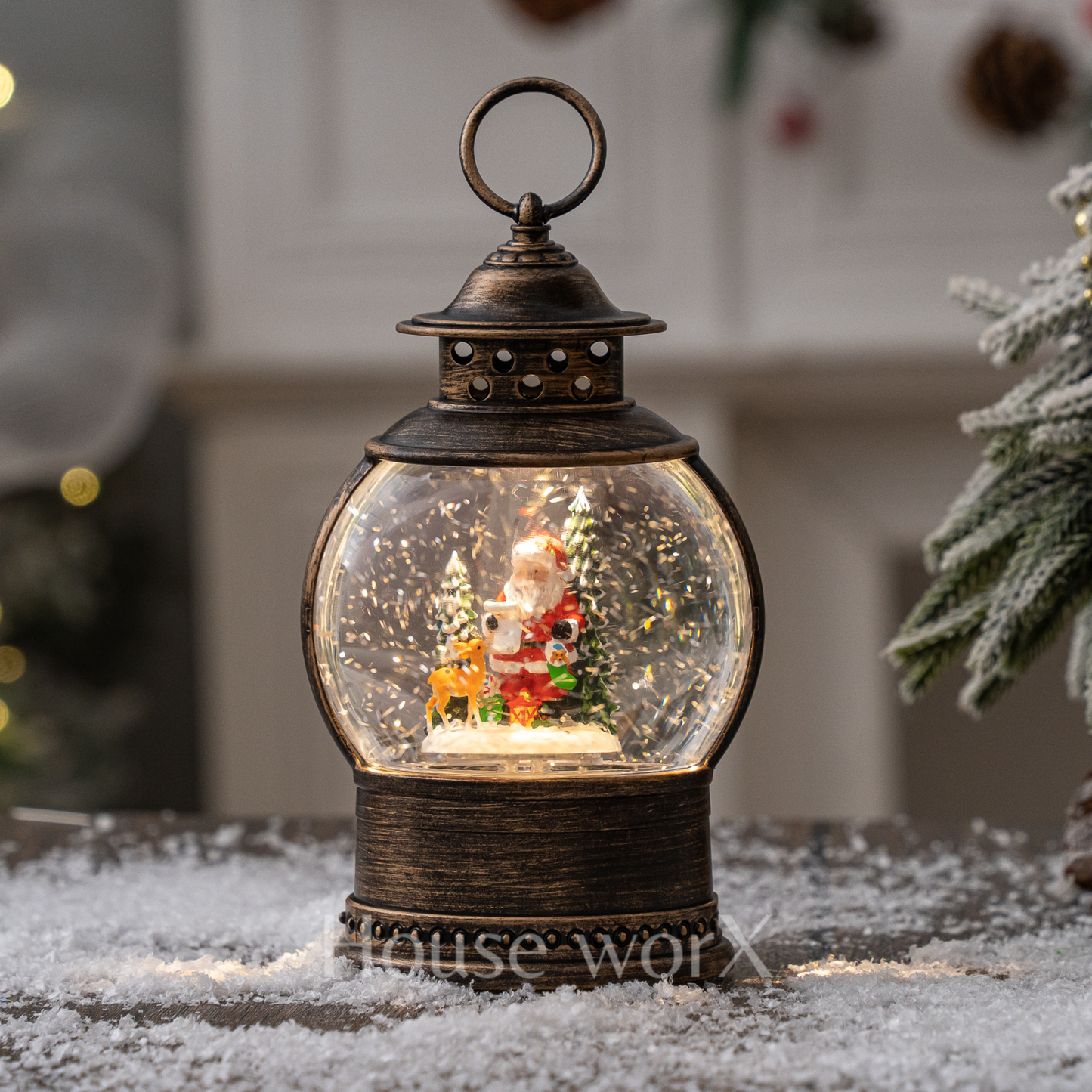 Decorative lantern snow globe with Santa Claus figure inside, on a snowy surface.