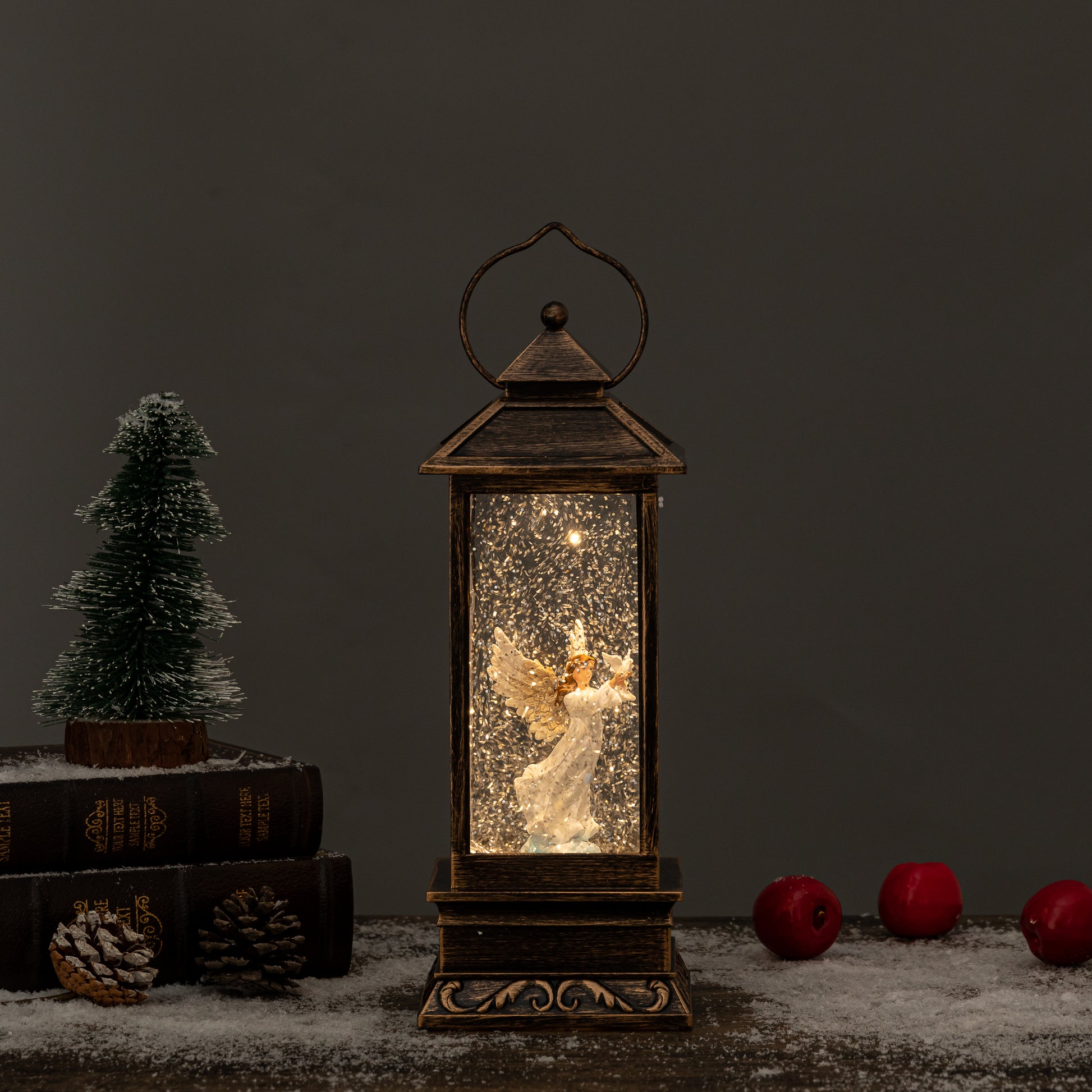 Angel and dove snow globes front view